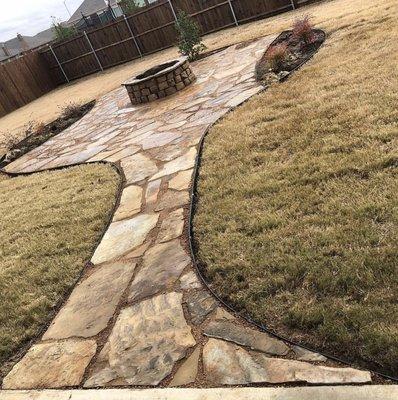 Walk way with fireplace, flowerbeds