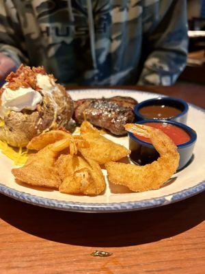 Fried shrimp, steak and Baked Potato Walt's Favorite Shrimp & 7 oz. Sirloin*