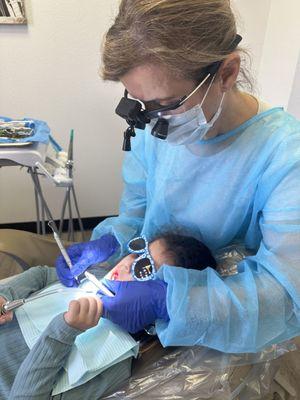 Dental hygienist cleaning my daughters teeth