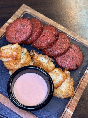 This is Dominican Salami (sausage) and fried cheese w/ pink sauce.