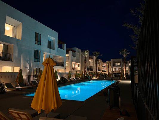 View of pool from outdoor table area