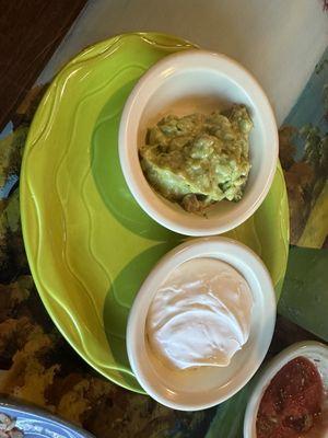 Side of guacamole and sour cream