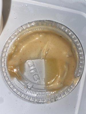 Here you see the Yum Yum sauce and there's a black strand of hair in the sauce.