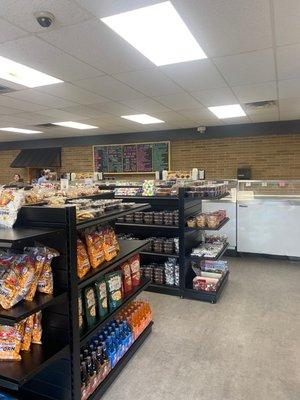 Newly remodeled store with a variety of chocolates, popcorn and ice cream.