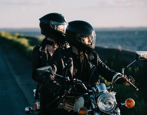 Couple riding motorcycle