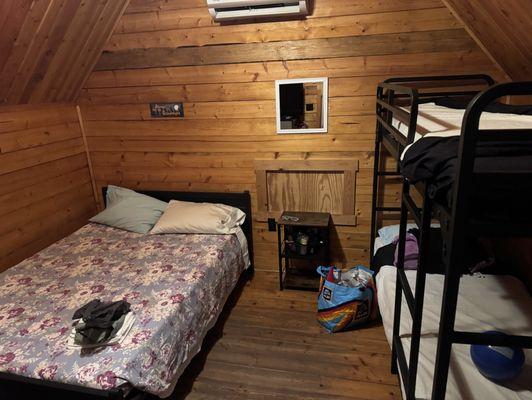 Inside the small cabin. Plenty of room w/ AC, TV and a mini fridge