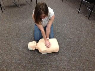 Student doing CPR in a class