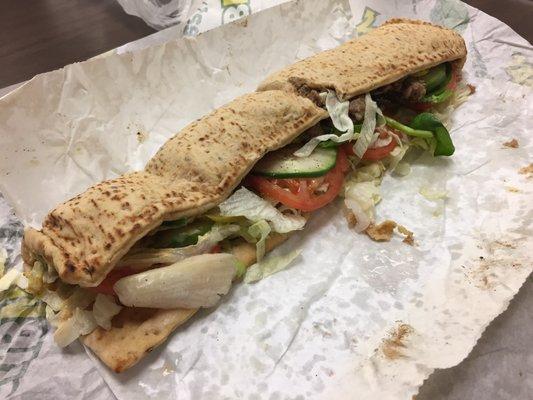 $7.00 special footlong beef sandwich on wheat flat bread