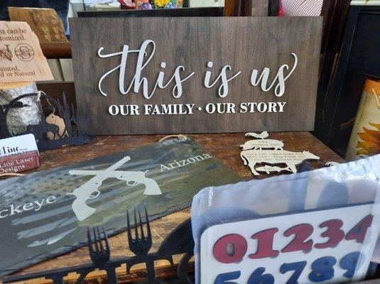 wooden farmhouse signs at The Enchanted Bullfrog in Buckeye, AZ.