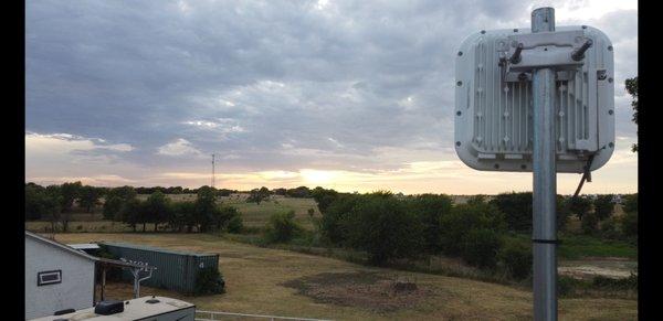 OneSource antenna. You can barely see it's tower in the center, about 5 miles away, right near the sun.