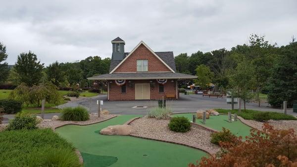 Building where you pay for golf, food and ice cream.