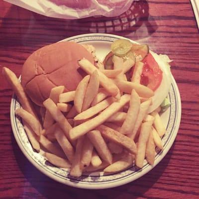 Chicken sandwich with a side of fries.