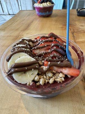 Açai smoothie bowl with banana, strawberry, granola, hemp seeds, and nutella