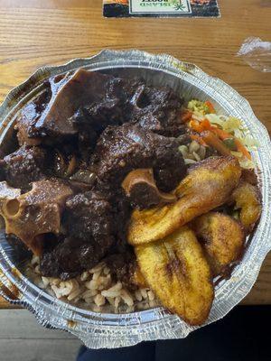 Oxtail, Plantains, rice and beans, side of veggies.