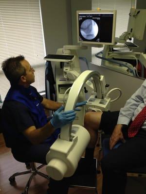 Dr. Scot Paris using fluoroscopy to treat a patient with Hyalgan