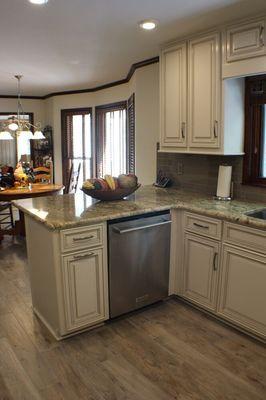 We added a pullout trash bin to the left of the dishwasher!