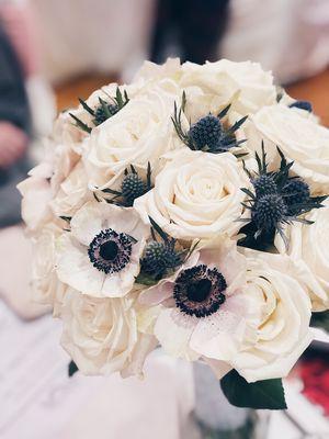 Playa Blanca roses, anemone and thistle bridal bouquet