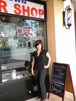 Manager Brenda in front of shop