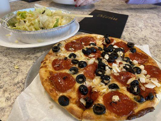 Tossed salad with cheese and small pizza with pepperoni, black olives & onions.