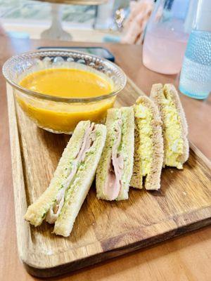 Variety of finger sandwiches paired with butternut squash soup