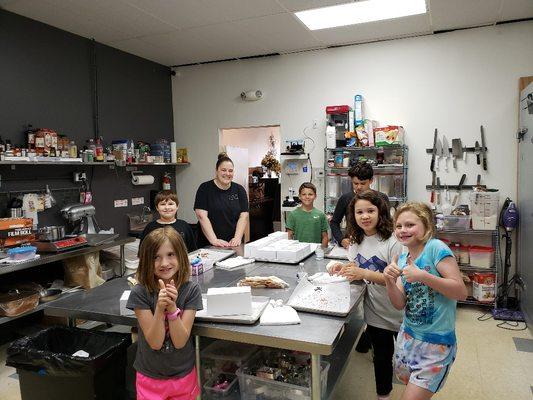 Summer Campers having FUN at a field trip to a local bakery.