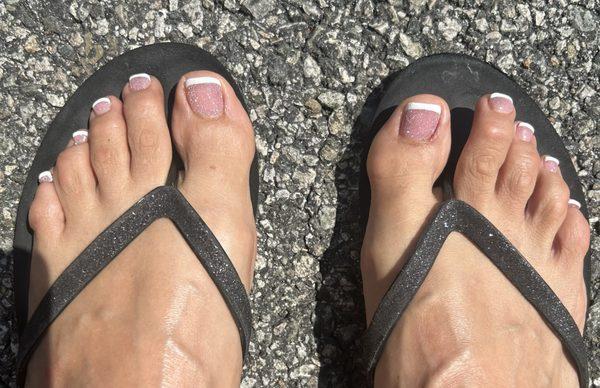 Gel French manicure with glitter polish.