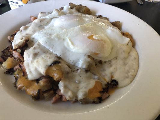 Western skillet with over easy egg and sausage gravy. Yummy!  Add some hot sauce!