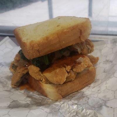 Whiting Sandwich with fried onions and spinach