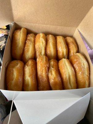 A dozen glazed donuts