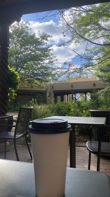 Caramel latte, body while relaxing in the garden outside the shop