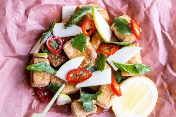 Crispy tofu drizzled with spiced cider syrup and served with crisp apple slices and pickled chiles. (Vegan and Gluten Free)