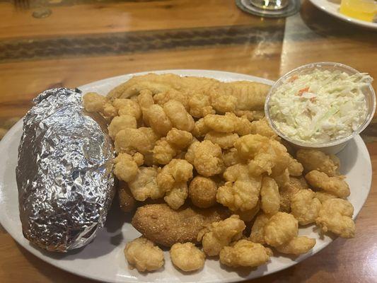 Lunch special of Popcorn Shrimp and Flounder with a Baked Potato and their excellent slaw