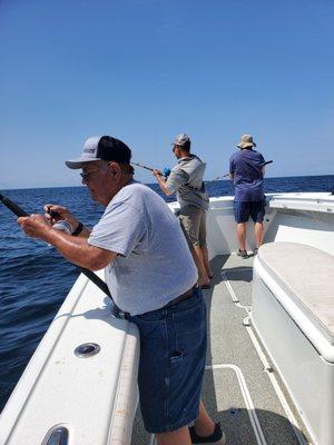 Our dad reeling in the cash.