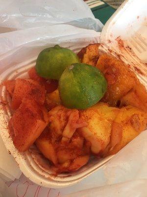 This little to go box is filled with Mango and Papaya with lime, chili powder and Valentina. This place is clean and nice