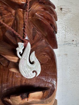 Cow bone fishhook with hand braided string