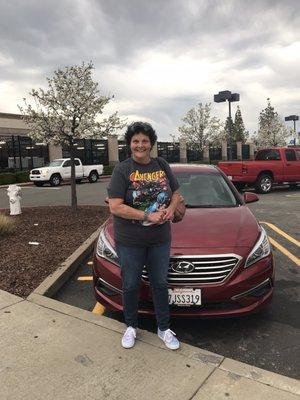 My sister with her new car.