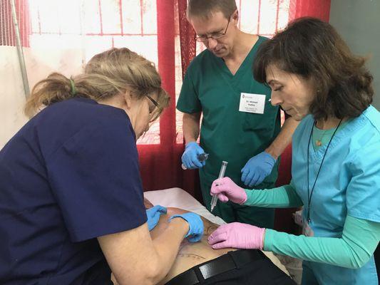 Dr. Tucker instructing other physicians in technique for treating the ligaments with PRP and prolotherapy to heal low back pain.