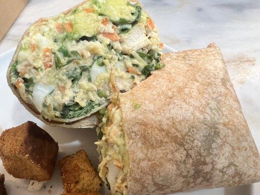 Wrap = tropical chicken, romaine & spinach, carrot, avocado, hard boiled eggs, creamy cesar dressing, whole wheat tortilla.