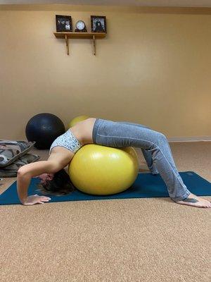 Bridge pose with yoga ball.