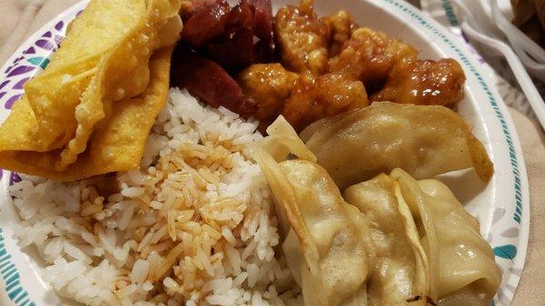 Boneless ribs, orange chicken, dumplings, no meat wontons and rice with soy sauce.