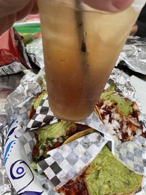 Adobada tacos packed with meat with a double long island from bar sin nombre