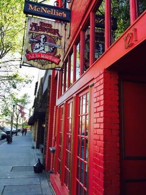 Love the red exterior and the old fashioned sign.