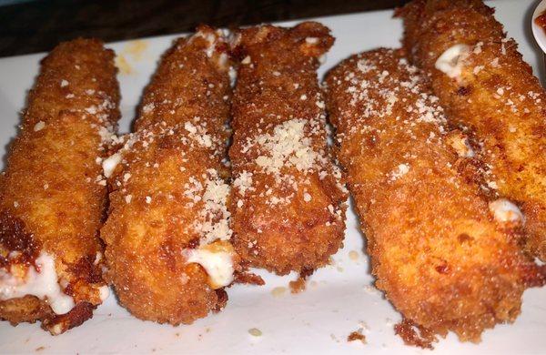 Close up of mozzarella sticks.  They are huge!