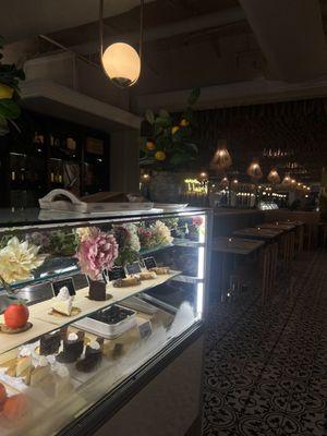 Dessert display and a large portion of the restaurant's indoor seating