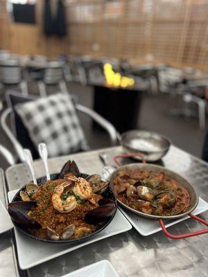 Seafood and chicken paella, clams with chorizo