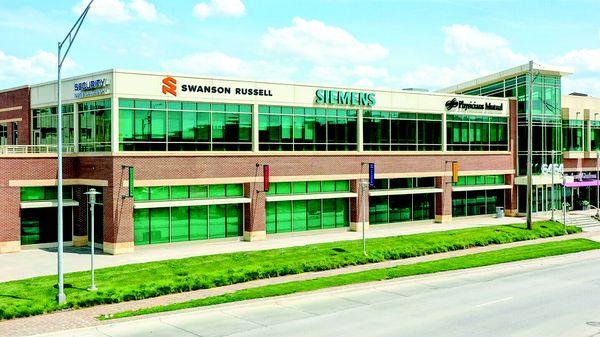 Exterior photo of the building Swanson Russell is in in Aksarben Village in Omaha, NE