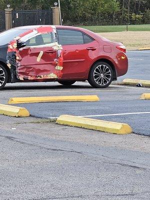 One of the cars in the parking lot