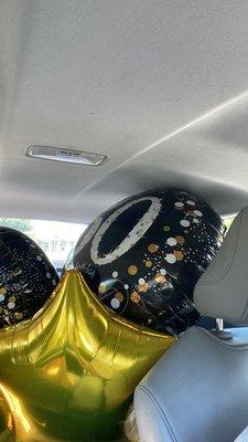 Birthday balloons in the car