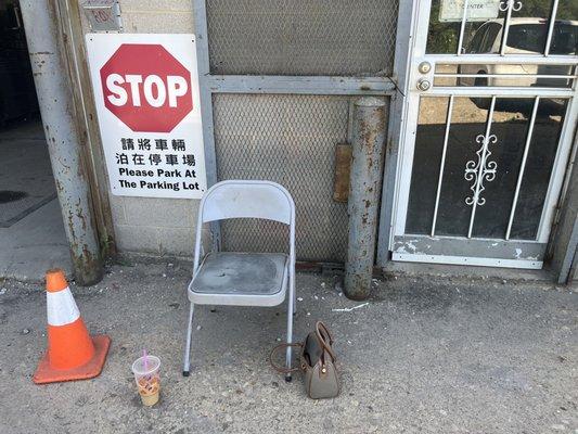 Where the customer waits when it's 99 degrees instead of the air conditioned waiting area.