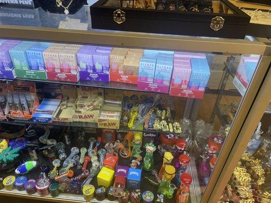 The bongs and pipes located by the register under the jewelry.